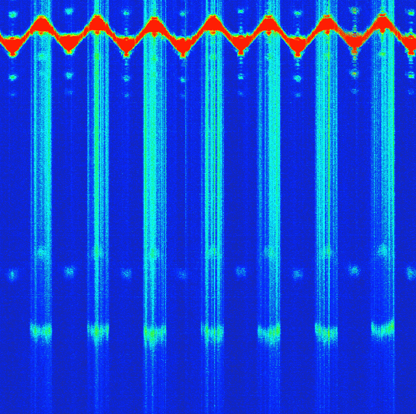 Cross-sectional image of a flexible printed circuit cable with automatic measurement of insulation layer thickness above embedded conductors.